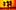 Three blurred, silhouetted figures appear to be in motion against a bright yellow and orange background resembling a setting sun, creating an abstract, dreamlike effect.